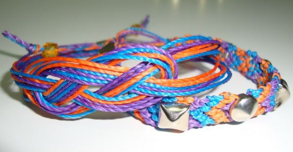 Duble de pulseiras  - Infinito e macramê com tachas.